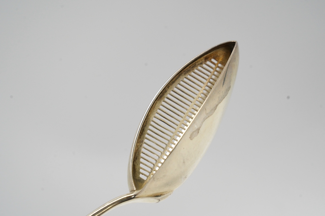 A George III silver Old English pattern basting/straining spoon, Smith & Fearn, London, 1791, 29.6cm, weight 136 grams. Condition - fair